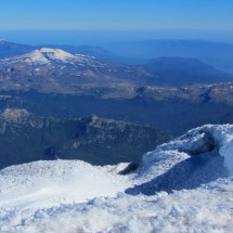Volcanoes Villarrica and Quetrupillan from the top of Volcan Lanin